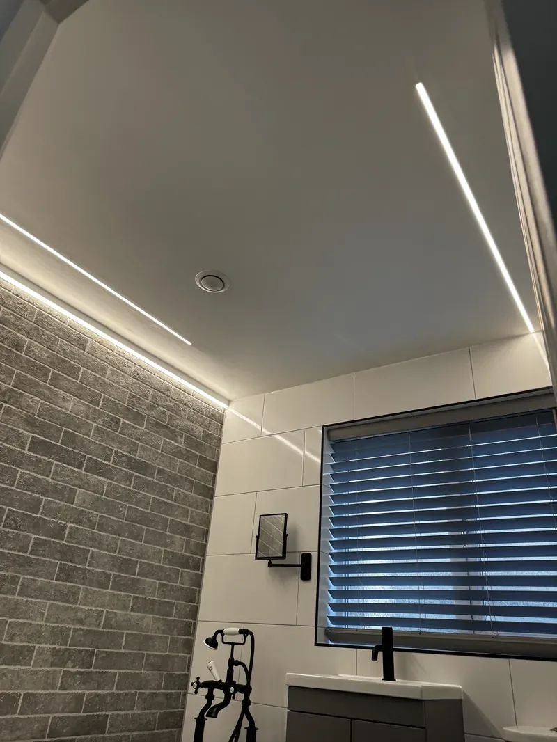 Completed bathroom with LED feature lighting installed by Entigen