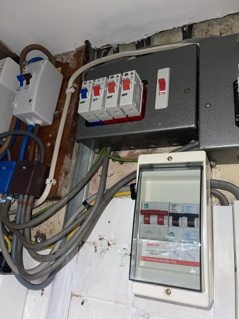 Older consumer unit arrangement before upgrade in Barton Seagrave