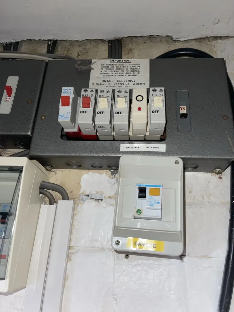 Multiple older fuse boards and distribution equipment before consolidation