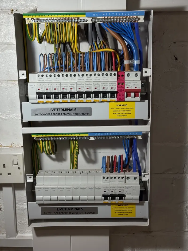 Open double-stack FuseBox consumer unit showing RCBO protection and surge protection