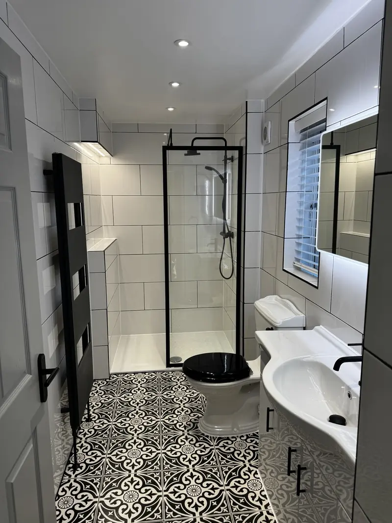 IP66 LED strip lighting concealed within a shower bulkhead in a luxury Kettering bathroom
