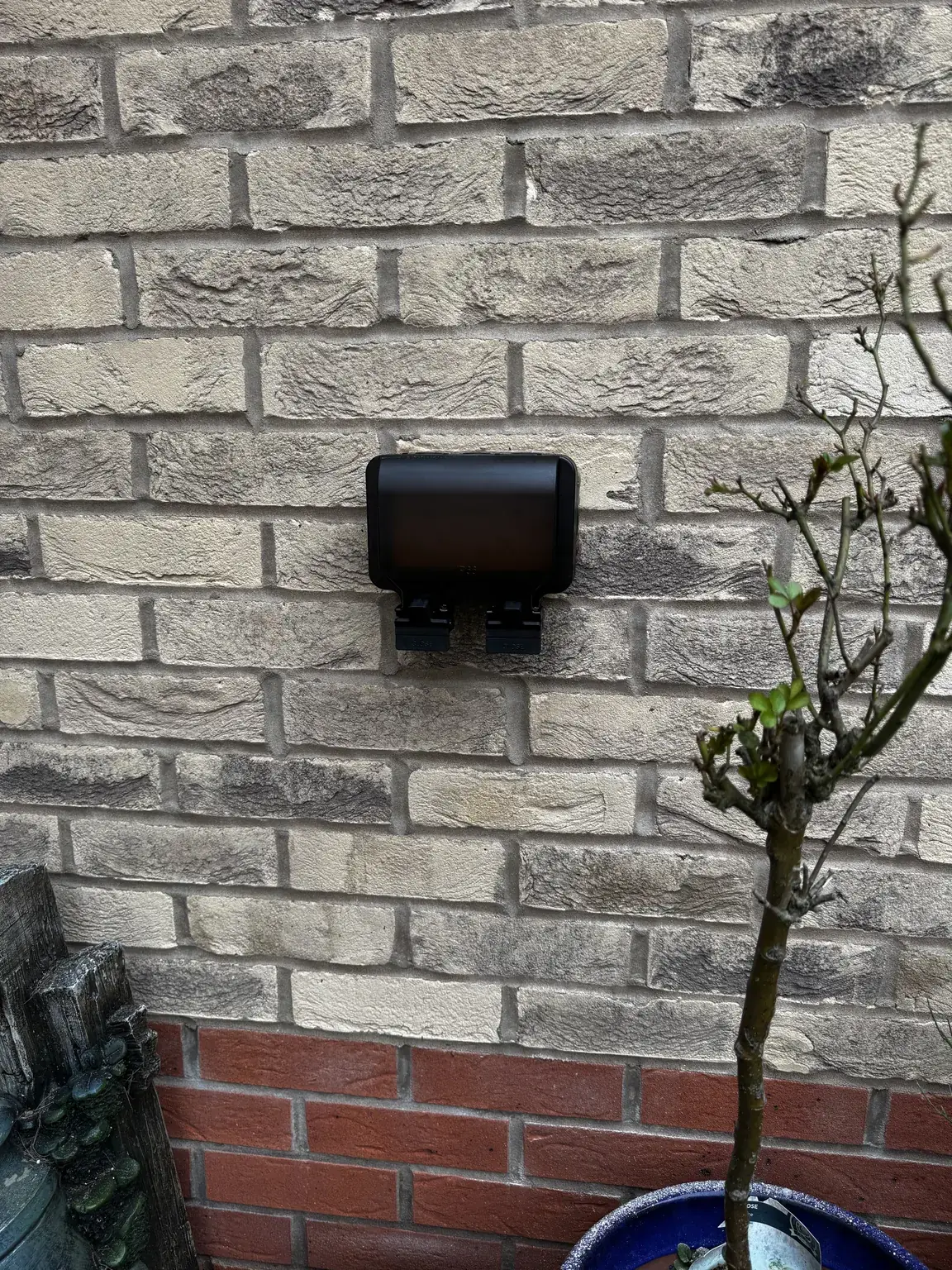 IP66 weatherproof outdoor socket installed on a garage wall at a Priors Hall home in Corby