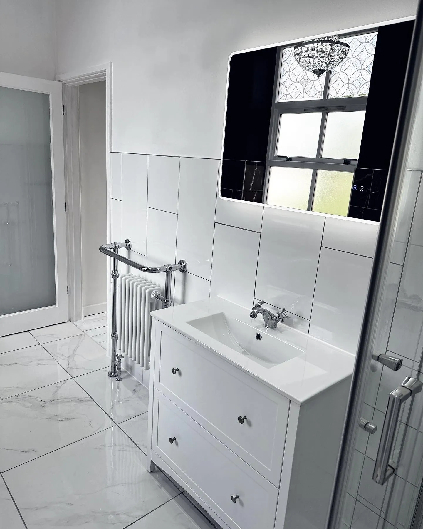 LED mirror lighting and underfloor heating in a luxury Entigen bathroom renovation