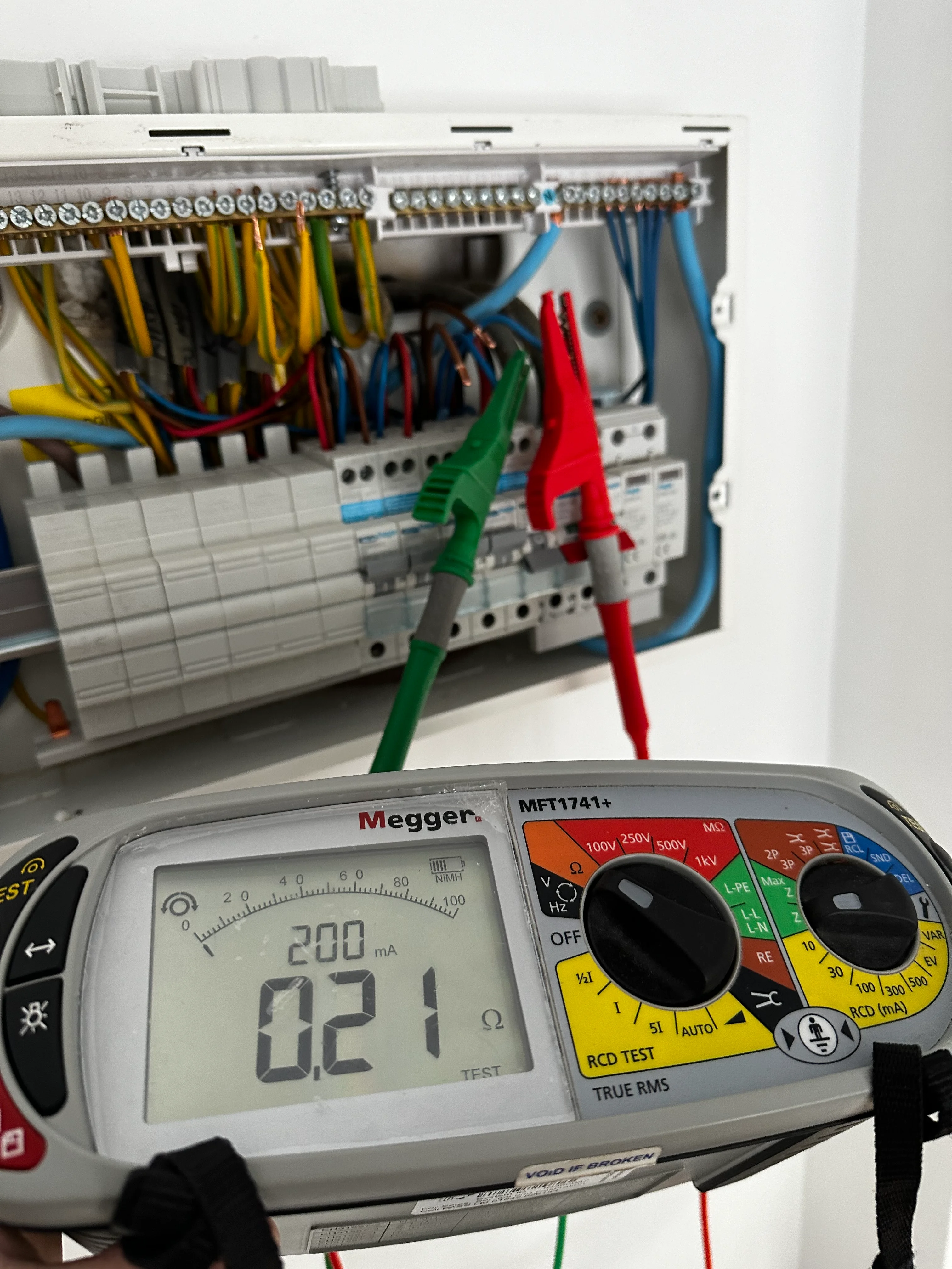 Entigen electrician using testing equipment to diagnose an electrical fault in Kettering