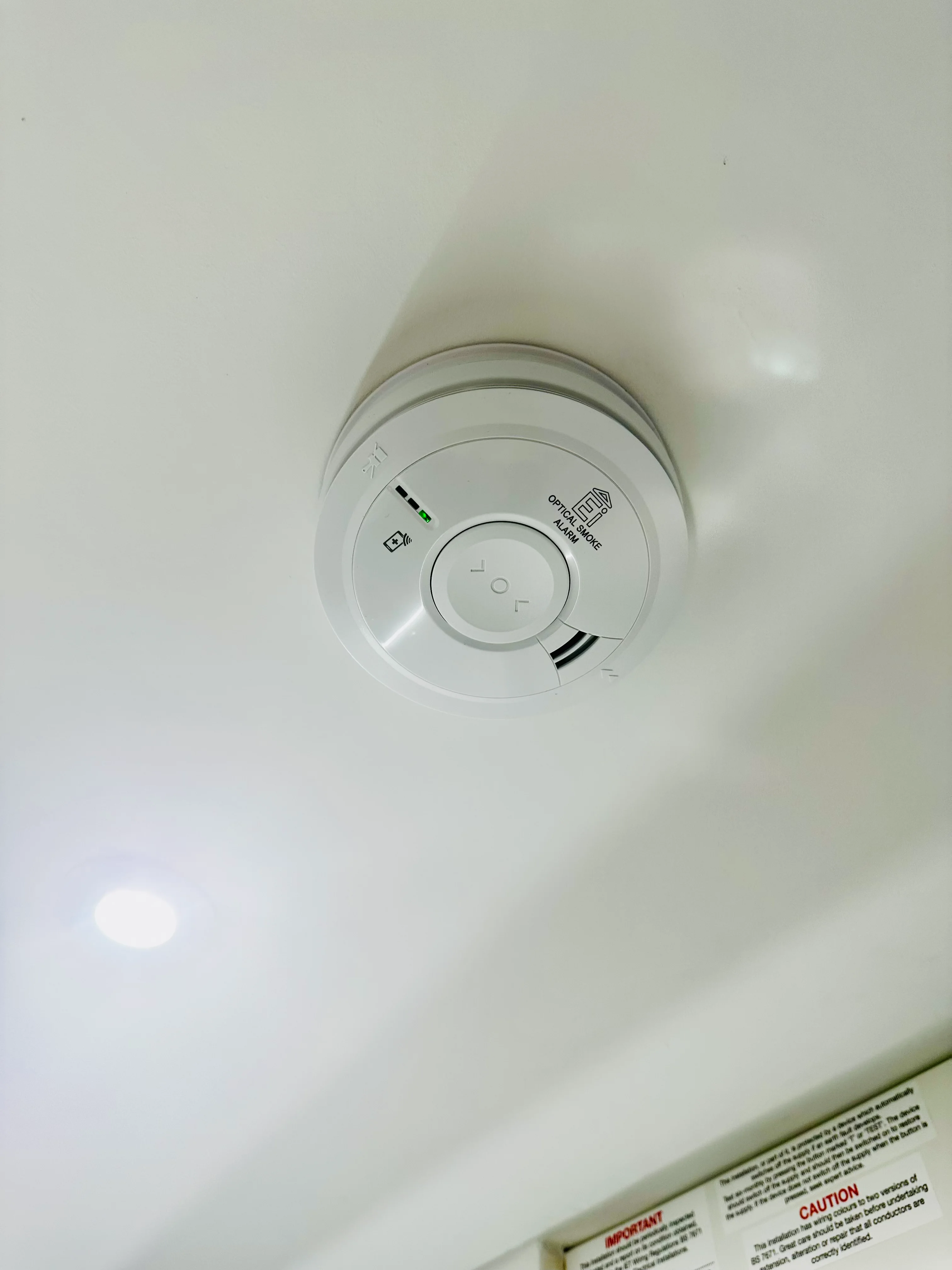 Mains-linked smoke alarm installed by Entigen in a Kettering property