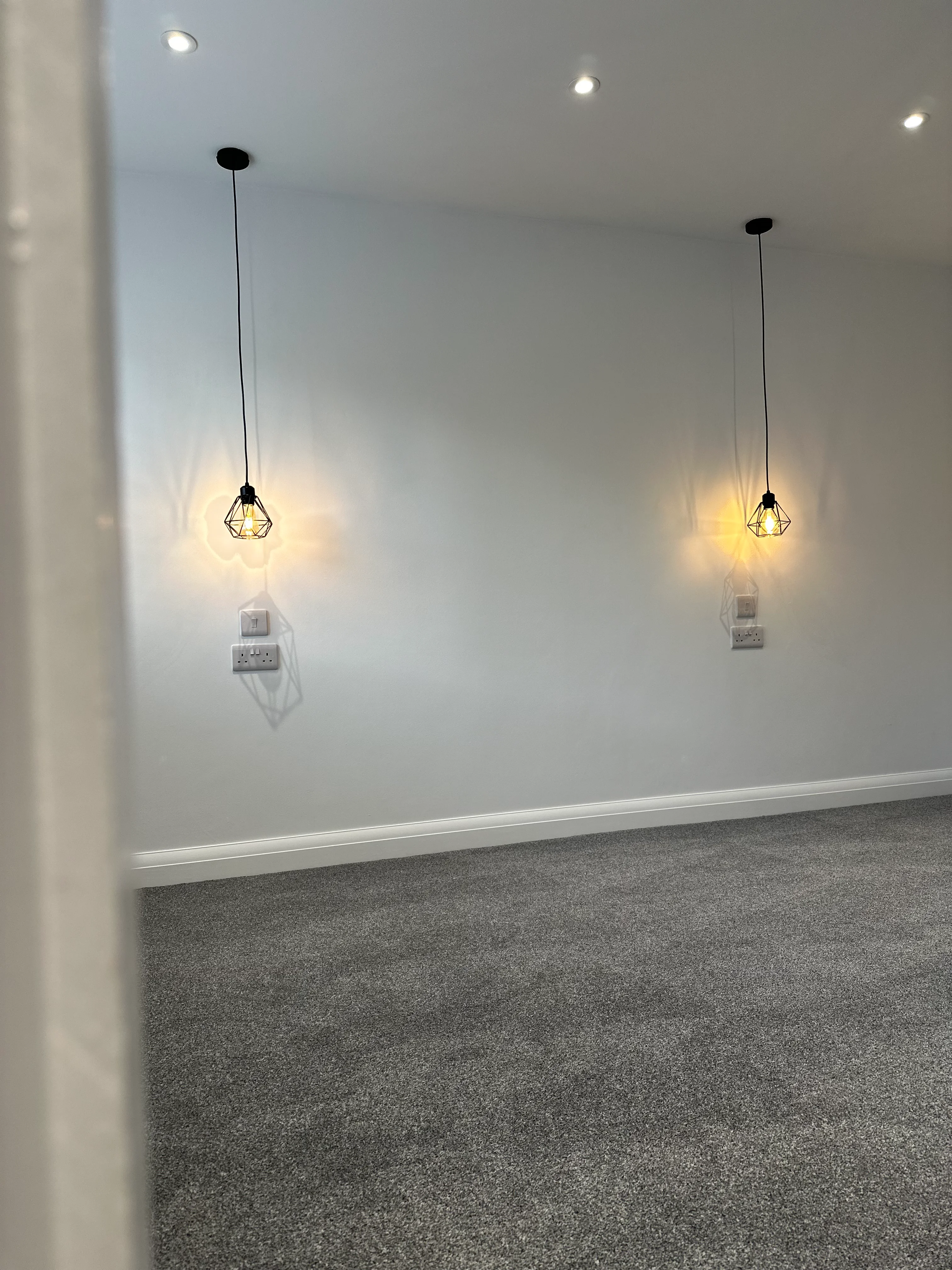 Staircase renovation — premium dark carpet and chrome handrail